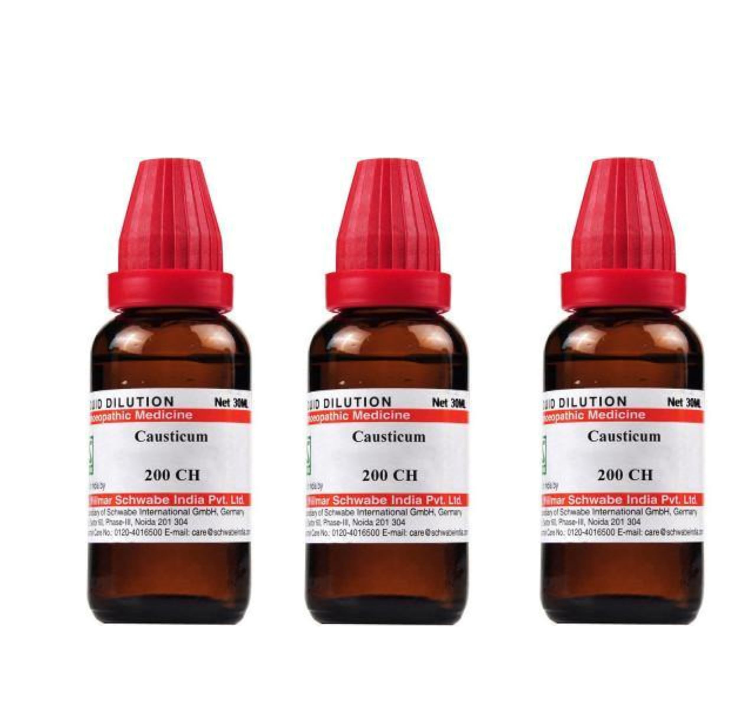 Three amber-colored bottles of Causticum homeopathic liquid, labeled 200 CH